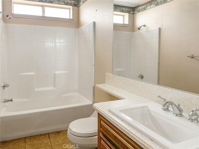 full bath with shower / bath combination, vanity, toilet, and tile patterned floors