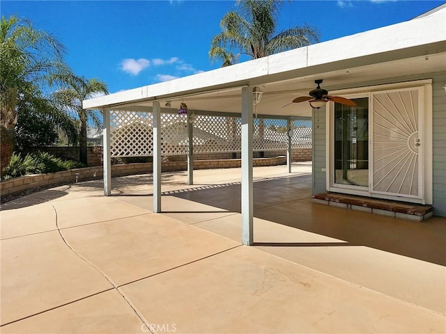 view of patio / terrace featuring fence and a ceiling fan