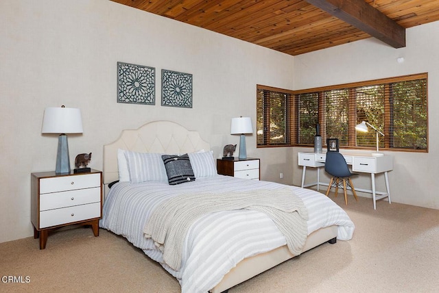 bedroom with beamed ceiling, wooden ceiling, and light colored carpet