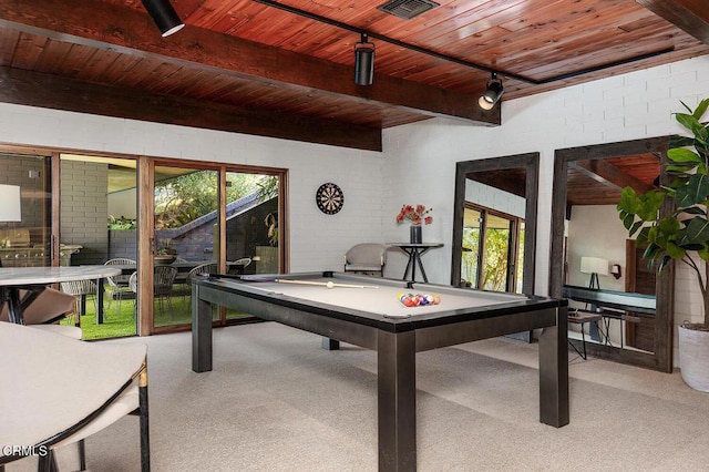 game room featuring pool table, beamed ceiling, wooden ceiling, and brick wall