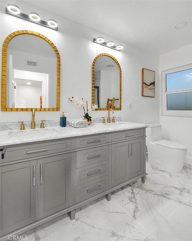 full bath featuring marble finish floor and a sink