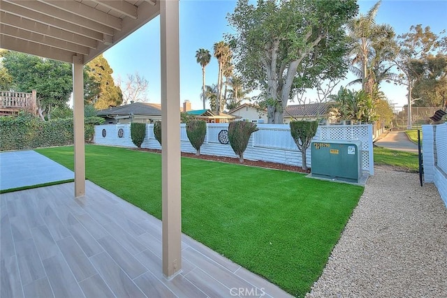 view of yard featuring a patio area and fence