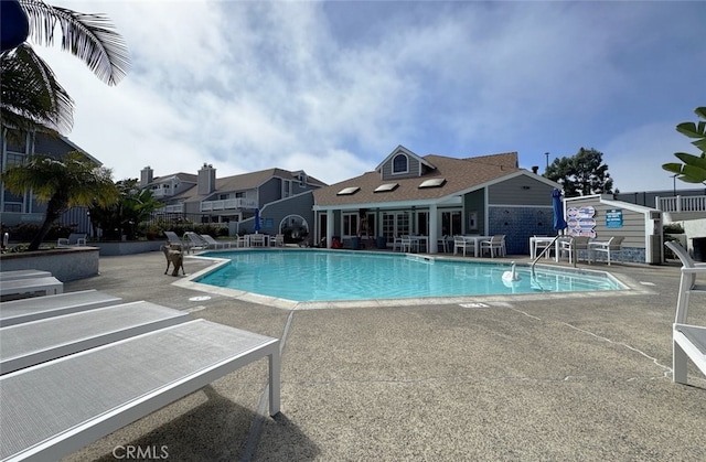 pool with a patio area