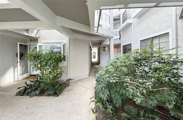 property entrance featuring stucco siding