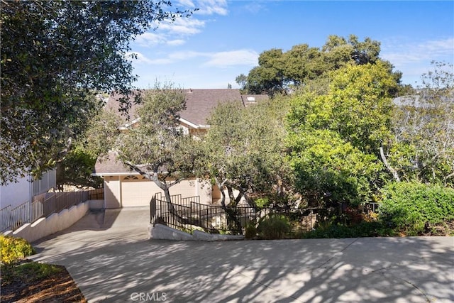 view of front of home with fence and stucco siding