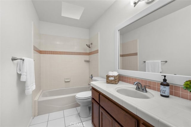 bathroom with shower / bath combination, toilet, tile patterned floors, vanity, and backsplash