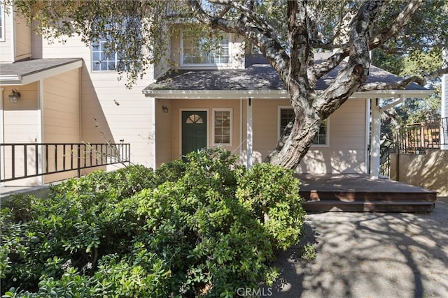 view of front of home with roof with shingles