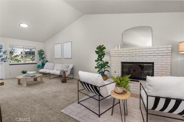 living room featuring carpet, a fireplace, and lofted ceiling