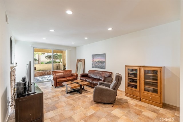 living area featuring recessed lighting and stone finish flooring