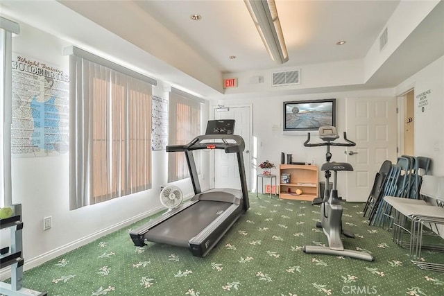 exercise area featuring carpet, baseboards, and visible vents