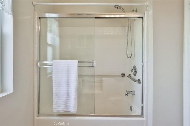 bathroom featuring enclosed tub / shower combo