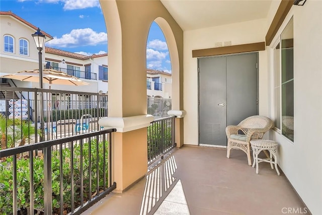 balcony featuring a sunroom