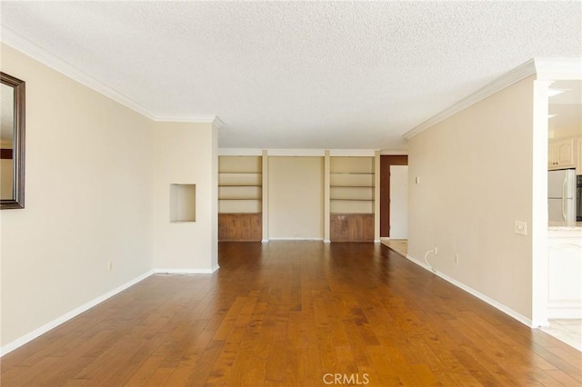 32709 Seagate Dr Unit 108, Rancho Palos Verdes, CA 90275 - unfurnished room featuring ornamental molding, hardwood / wood-style floors, a textured ceiling, and built in shelves