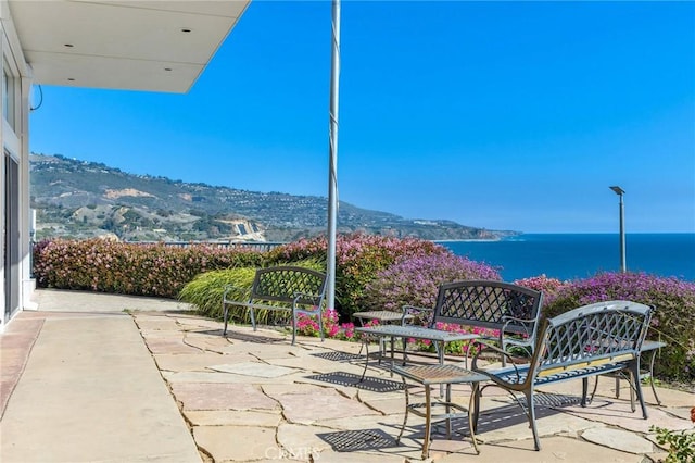 view of patio / terrace with a water view