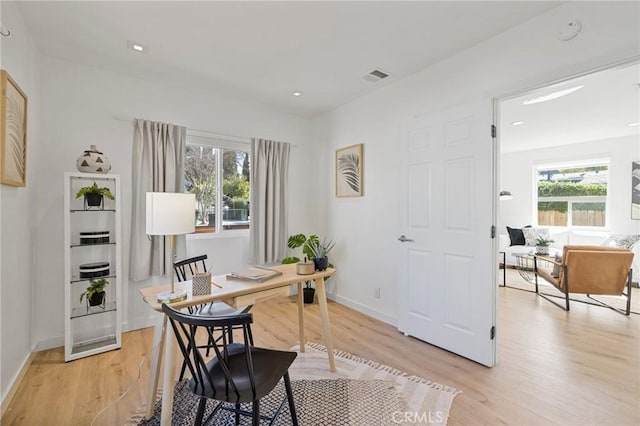 office with light wood-type flooring, visible vents, baseboards, and recessed lighting