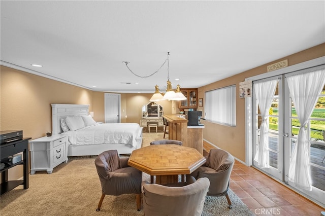 bedroom featuring access to exterior, ornamental molding, and recessed lighting