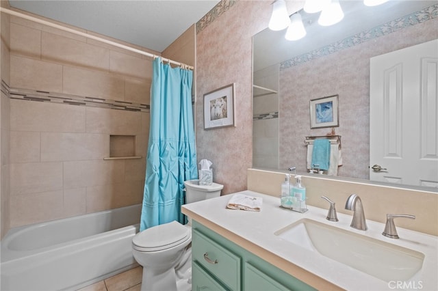 bathroom with toilet, vanity, tile patterned floors, shower / bath combination with curtain, and wallpapered walls