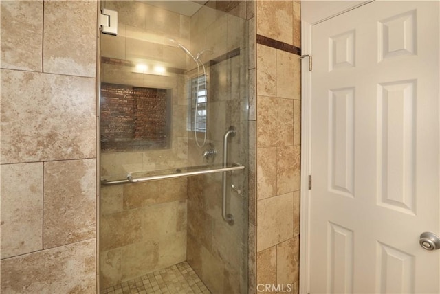 bathroom with a shower stall