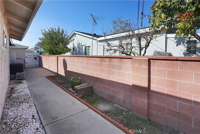 exterior space with a gate and a fenced backyard