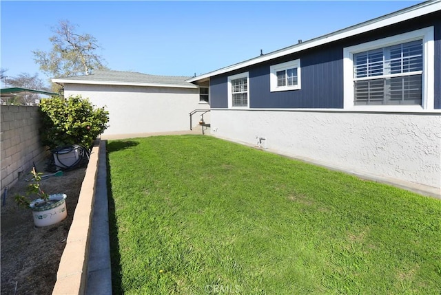 view of yard with fence