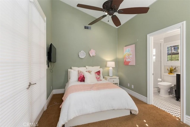 carpeted bedroom with vaulted ceiling, ensuite bath, visible vents, and baseboards