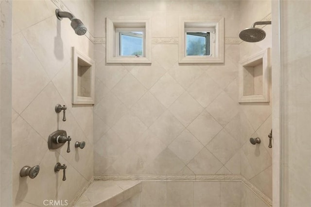 bathroom featuring a tile shower