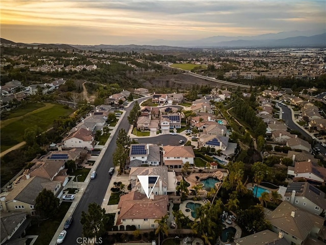 aerial view at dusk with a residential view