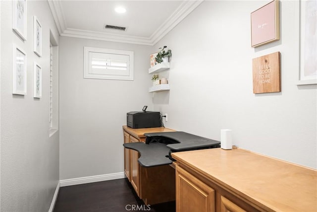 office space featuring baseboards, visible vents, ornamental molding, and dark wood-style flooring