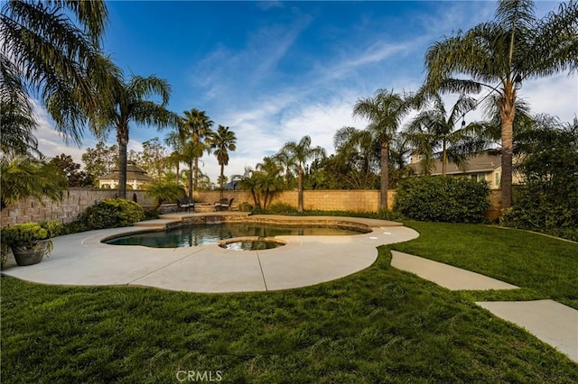 view of swimming pool featuring a fenced in pool, a fenced backyard, and a yard