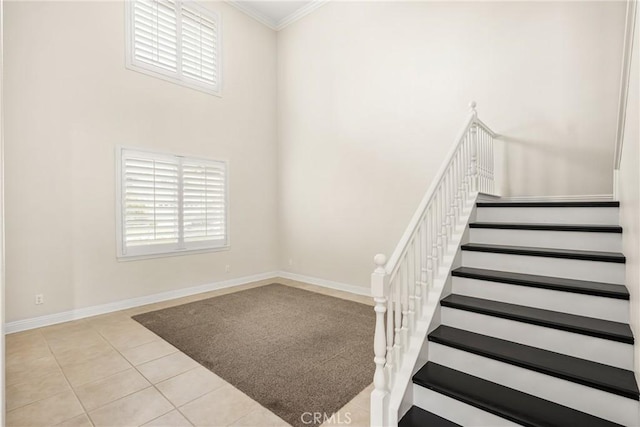 5444 Pine Ave, Chino Hills, CA 91709 - stairway featuring tile patterned floors, a high ceiling, ornamental molding, and baseboards