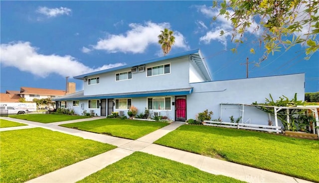 view of front of house with a front lawn and stucco siding