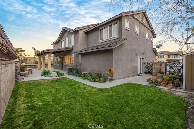 back of house featuring a patio, fence, a pergola, and stucco siding