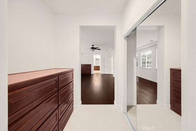 corridor with light wood-style floors