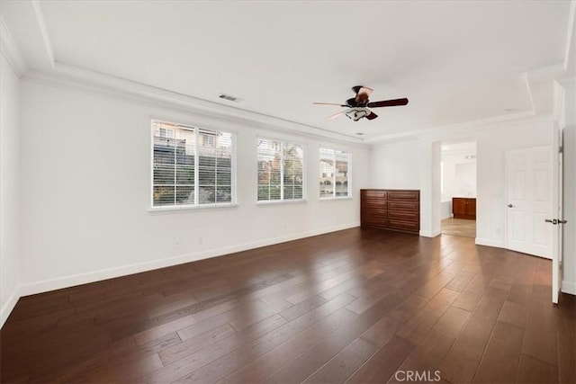 unfurnished bedroom featuring ornamental molding, dark wood finished floors, visible vents, and baseboards