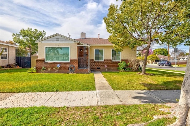 bungalow-style house featuring brick siding, fence, stucco siding, a chimney, and a front yard