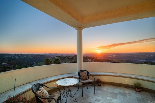 view of balcony at dusk