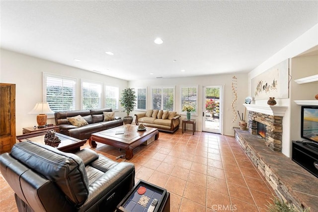 living room featuring recessed lighting, a fireplace, and light tile patterned floors