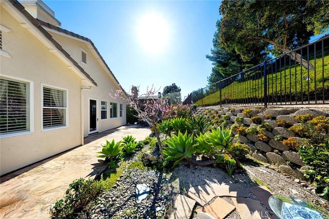 view of yard with a patio area and fence