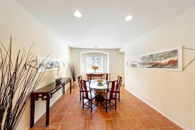 dining area with baseboards, recessed lighting, and tile patterned floors