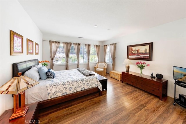 bedroom featuring wood finished floors