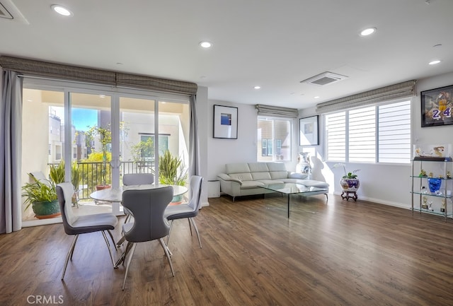 interior space featuring dark wood-style floors, baseboards, a wealth of natural light, and recessed lighting