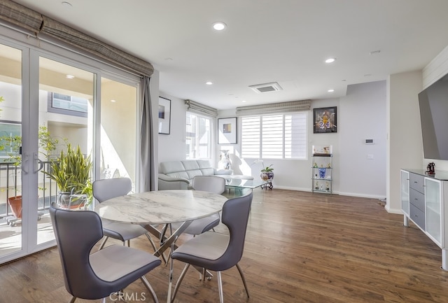 dining space with dark wood-style floors, baseboards, and recessed lighting