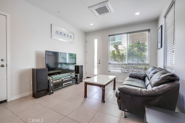 living area featuring recessed lighting, visible vents, baseboards, and light tile patterned floors