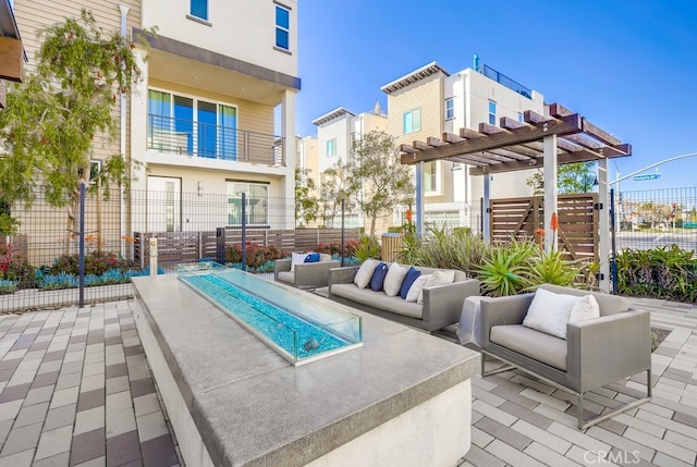 view of pool with a patio area, fence, and an outdoor hangout area