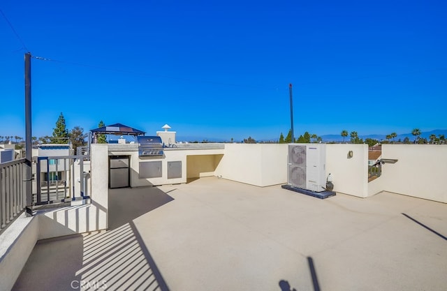 view of patio / terrace featuring exterior kitchen and area for grilling