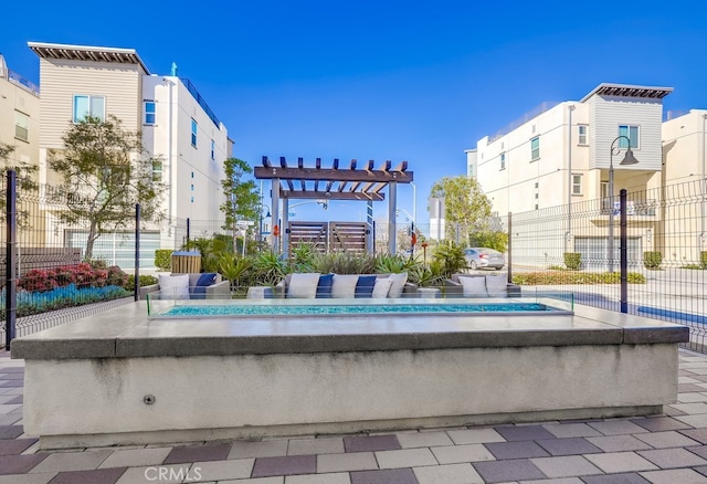 view of community featuring fence and a pergola