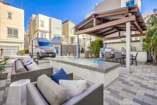 view of patio / terrace featuring a residential view, an outdoor hangout area, fence, outdoor dining area, and a gazebo