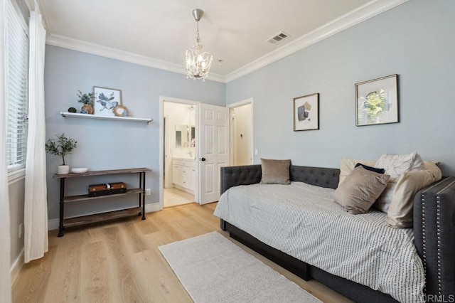 bedroom with light wood-style floors, visible vents, an inviting chandelier, and ornamental molding