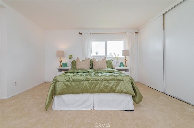 bedroom featuring light carpet