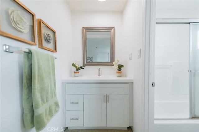 bathroom with a shower and vanity